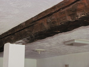 Beams off the ceilings in the basement, first and second floors